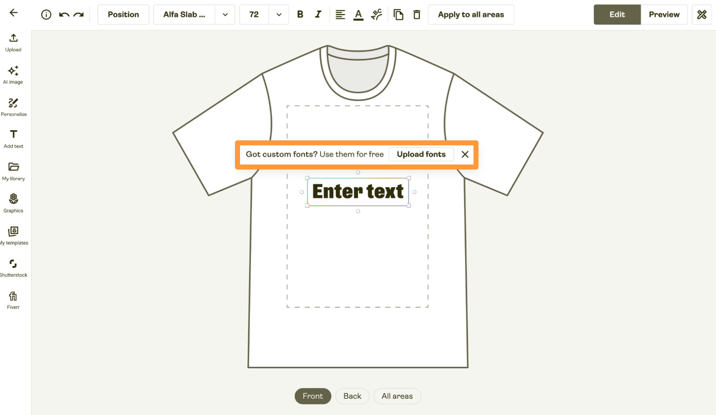 T-shirt design editor with editable text “Enter text” on the shirt and a banner about uploading custom fonts